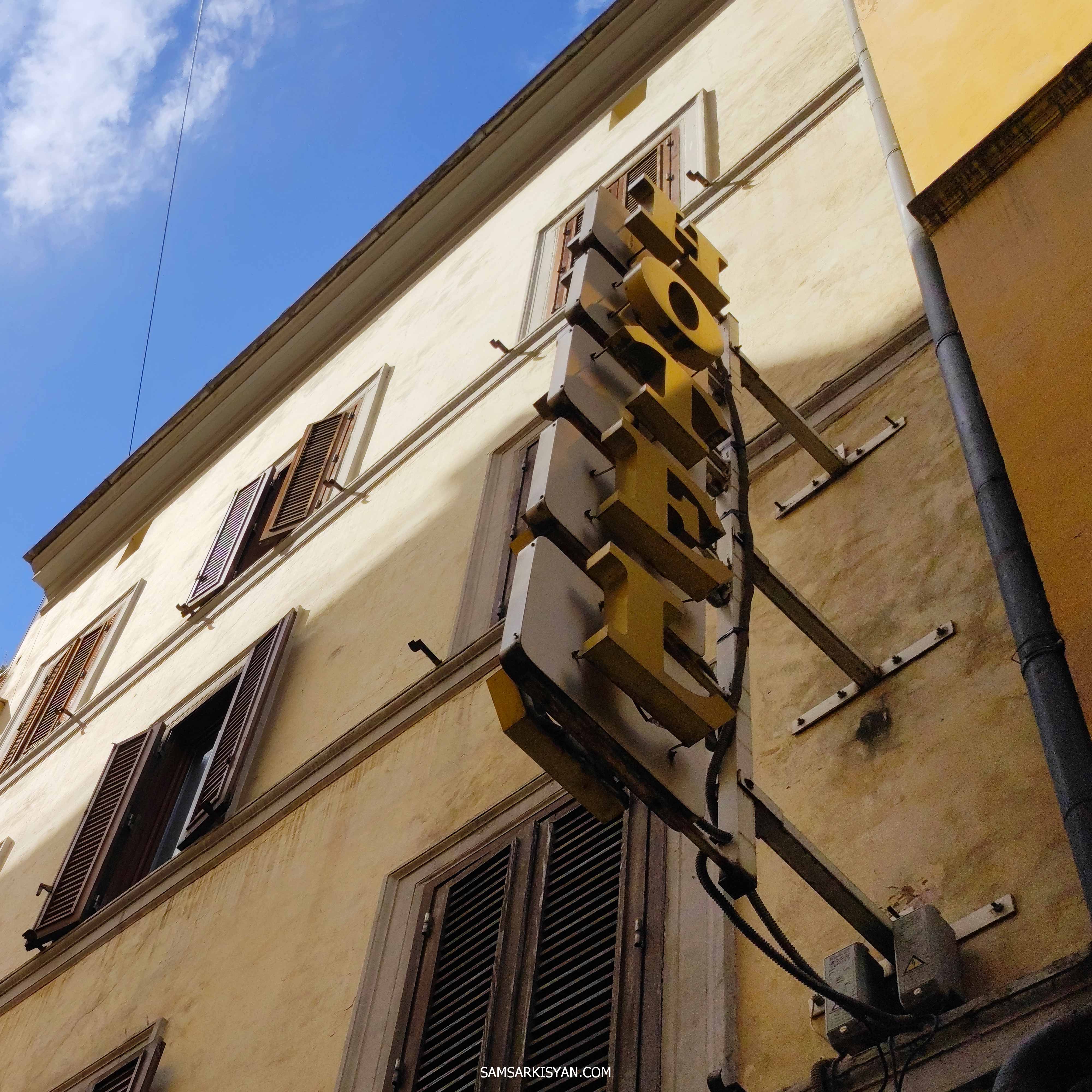 Decorations on the facades of a Roman buildings, hotel sign